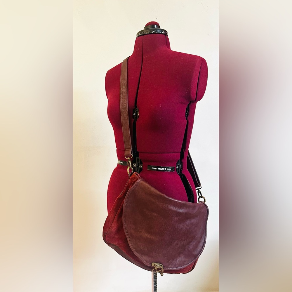 Maroon messenger bag. Faux suede and pleather. Brass clasp.